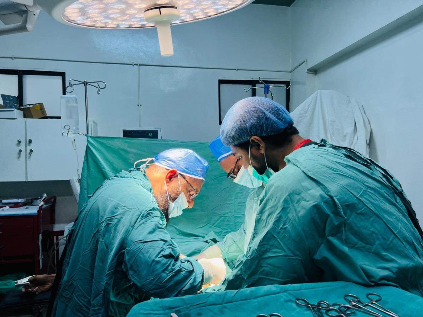 Surgeons at work in an operating theatre